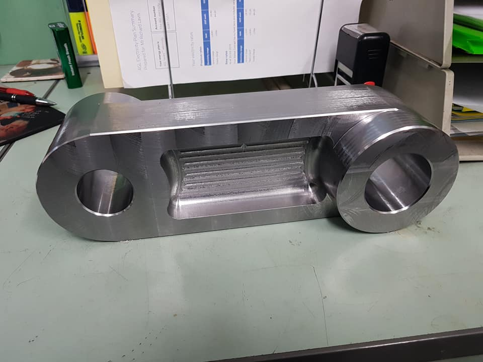 Precision-machined steel link component