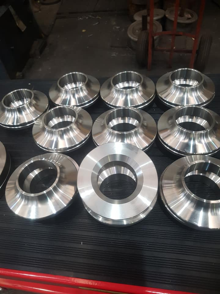 Finished machined steel block on the workshop bench