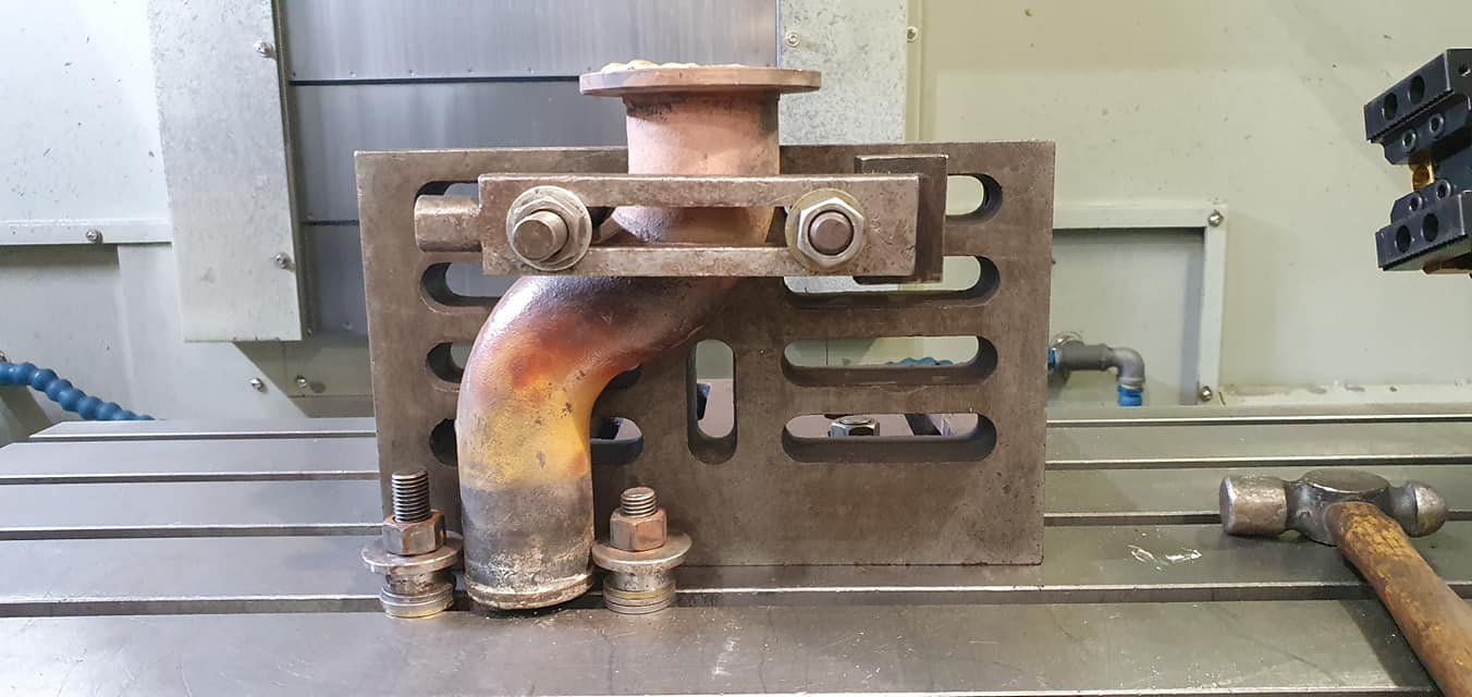 Pair of machined steel components ready for dispatch