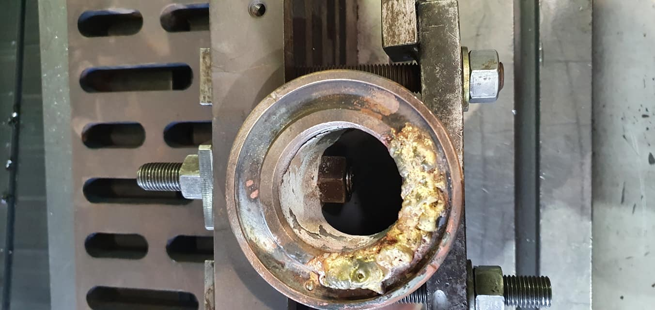 Precision-machined metal part under inspection